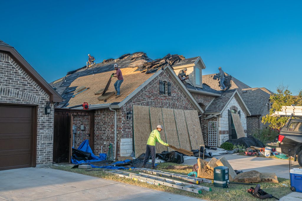 men repairing roof